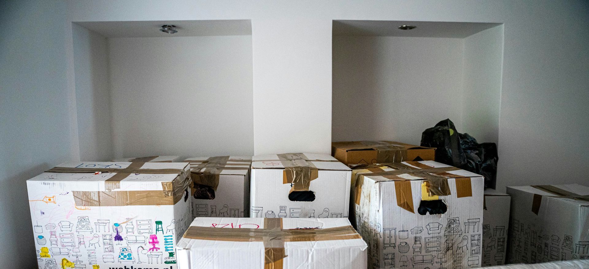 brown cardboard boxes on brown wooden table